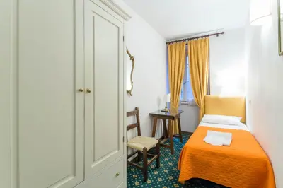 Letto o letti in una camera di Hotel Rex