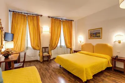 Letto o letti in una camera di Hotel Rex
