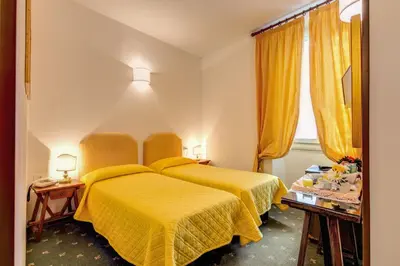 Letto o letti in una camera di Hotel Rex