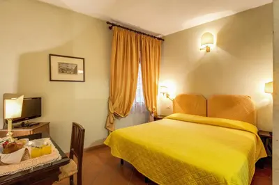 Letto o letti in una camera di Hotel Rex