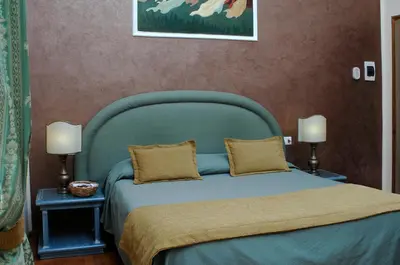 Letto o letti in una camera di Relais Dante e Beatrice