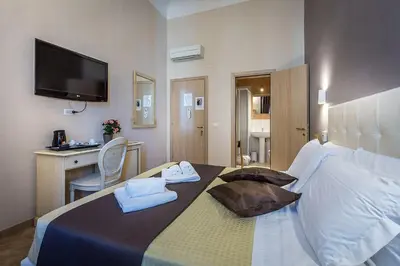 Letto o letti in una camera di Sognando Firenze