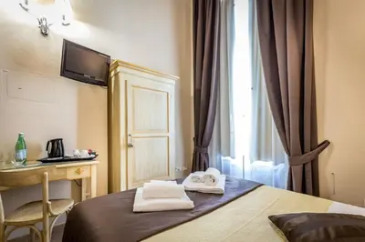 Letto o letti in una camera di Sognando Firenze