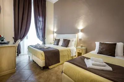 Letto o letti in una camera di Sognando Firenze