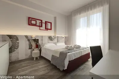Letto o letti in una camera di Dante & Virgilio Apartments by Mamo Florence