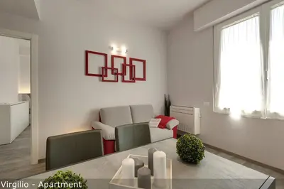Area soggiorno di Dante & Virgilio Apartments by Mamo Florence