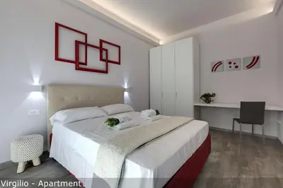 Letto o letti in una camera di Dante & Virgilio Apartments by Mamo Florence