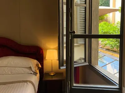 Letto o letti in una camera di Numa Florence Palazzo San Niccolò