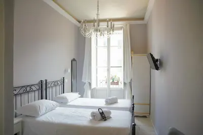 Letto o letti in una camera di Affittacamere ALBA