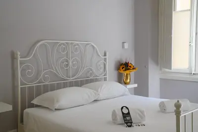 Letto o letti in una camera di Affittacamere ALBA