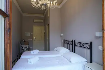 Letto o letti in una camera di Affittacamere ALBA