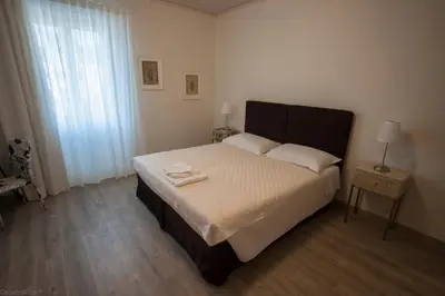 Letto o letti in una camera di Dimora 16 Rooms & Garden