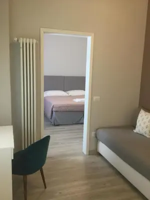 Letto o letti in una camera di Dimora 16 Rooms & Garden