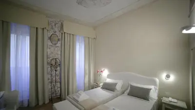 Letto o letti in una camera di Hotel Renaissance