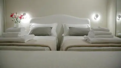 Letto o letti in una camera di Hotel Renaissance