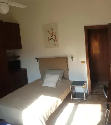 Letto o letti in una camera di B&B Jacopino