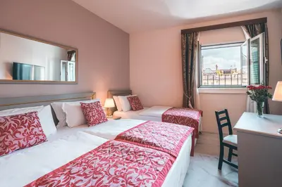 Letto o letti in una camera di Hotel Palazzo Benci