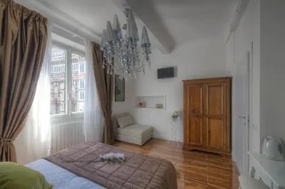 Letto o letti in una camera di Flower Cathedral Firenze