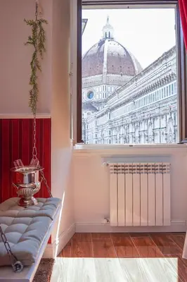 Letto o letti in una camera di Flower Cathedral Firenze