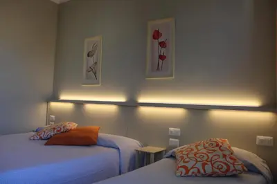 Letto o letti in una camera di Hotel Delfina
