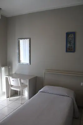 Letto o letti in una camera di Hotel Delfina