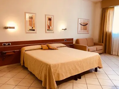 Letto o letti in una camera di Hotel Delfina