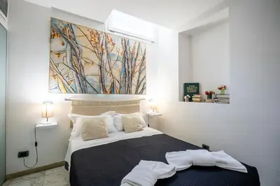 Letto o letti in una camera di 11 Duomo - Monolocale caratteristico