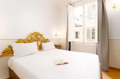 Letto o letti in una camera di Residenza Conte di Cavour & Rooftop - dBe Hotels