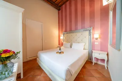 Letto o letti in una camera di Residenza Conte di Cavour & Rooftop - dBe Hotels