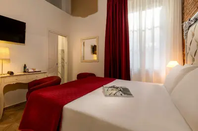 Letto o letti in una camera di Residenza Conte di Cavour & Rooftop - dBe Hotels