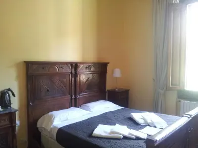 Letto o letti in una camera di Sangaggio House B&B