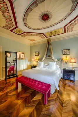 Letto o letti in una camera di Villa Cora