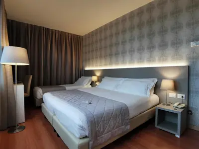 Letto o letti in una camera di Hotel President