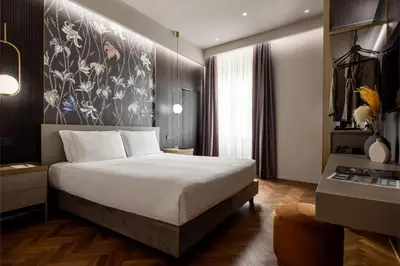 Letto o letti in una camera di Aramis Deluxe Rooms
