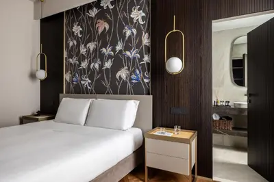 Letto o letti in una camera di Aramis Deluxe Rooms