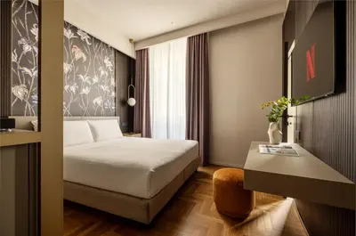 Letto o letti in una camera di Aramis Deluxe Rooms