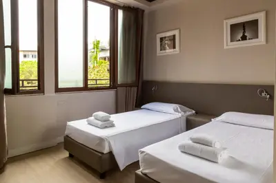 Letto o letti in una camera di Plus Florence
