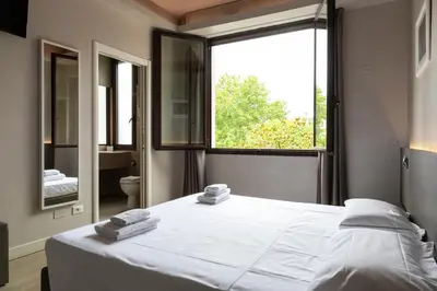 Letto o letti in una camera di Plus Florence