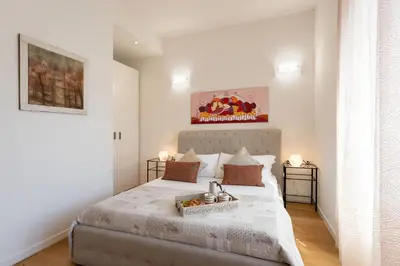 Letto o letti in una camera di Santa Maria Novella - Flo Apartments