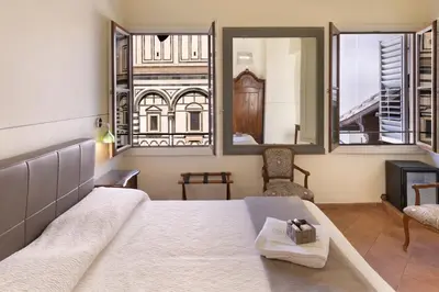 Letto o letti in una camera di B&B Soggiorno Battistero
