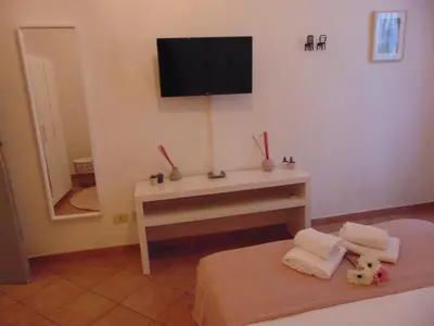 Letto o letti in una camera di Gessi Charming Apartments