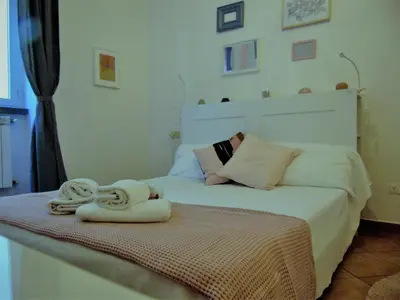 Letto o letti in una camera di Gessi Charming Apartments