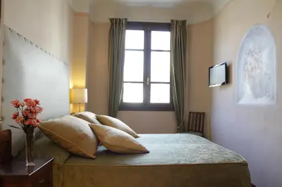 Letto o letti in una camera di B&B A Florence View
