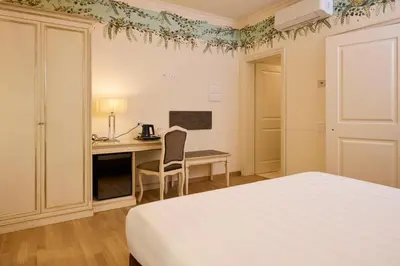 Letto o letti in una camera di Hotel Art Atelier - Place of Charme