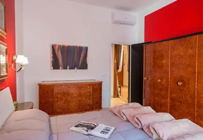 Letto o letti in una camera di La Galerie Luxury Apartment by Mamo Florence
