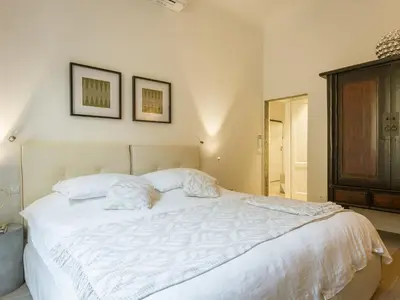 Letto o letti in una camera di San Firenze Luxury Apartment by Mamo Florence