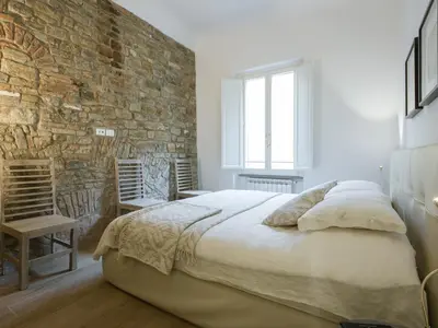 Letto o letti in una camera di San Firenze Luxury Apartment by Mamo Florence