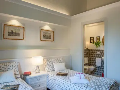 Letto o letti in una camera di Atelier del Sarto Apartment by Mamo Florence