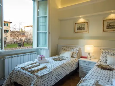 Letto o letti in una camera di Atelier del Sarto Apartment by Mamo Florence