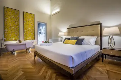 Letto o letti in una camera di Palazzo Ridolfi - Residenza d'Epoca